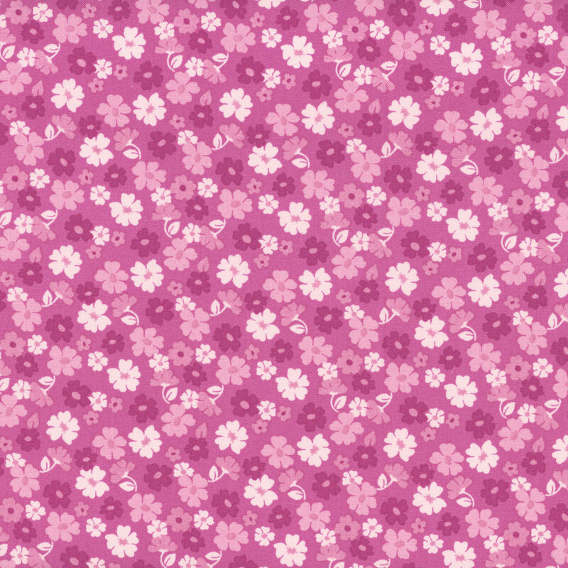 A repeating pattern of small flowers in shades of purple on a purple background.