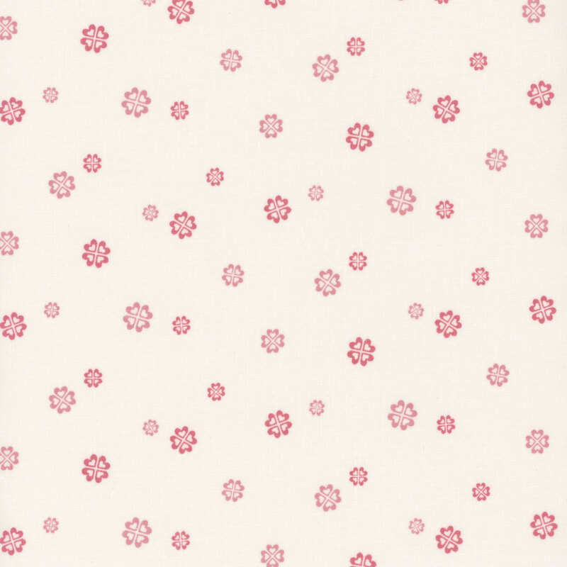 Pink floral blooms on a light cream background.