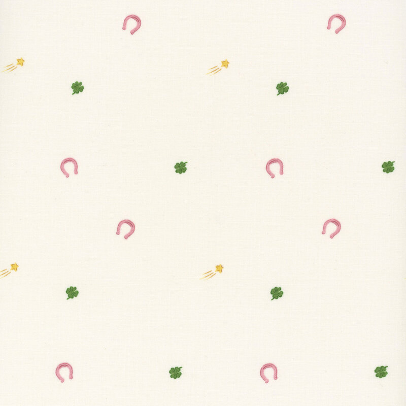 Cream fabric with tossed horseshoes, shooting stars, and four leaf clovers.