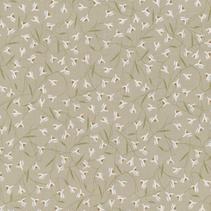 Taupe fabric with overlapping snowdrop flowers.