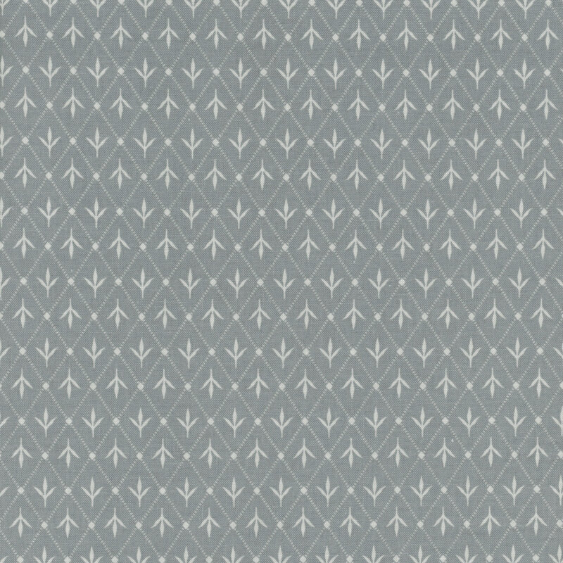 Cadet blue fabric with a lattice design and leafy motifs.
