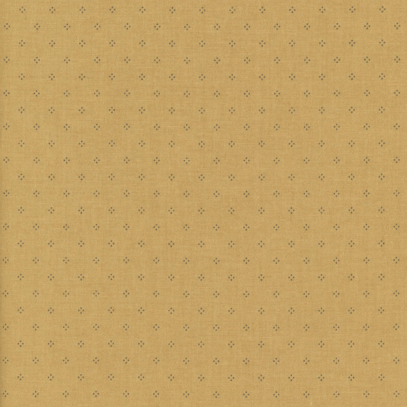 Golden yellow fabric with simple pinprick dotted designs.