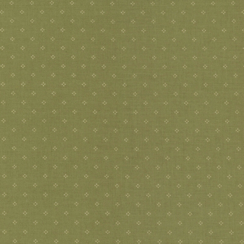 Green fabric with simple pinprick dotted designs.
