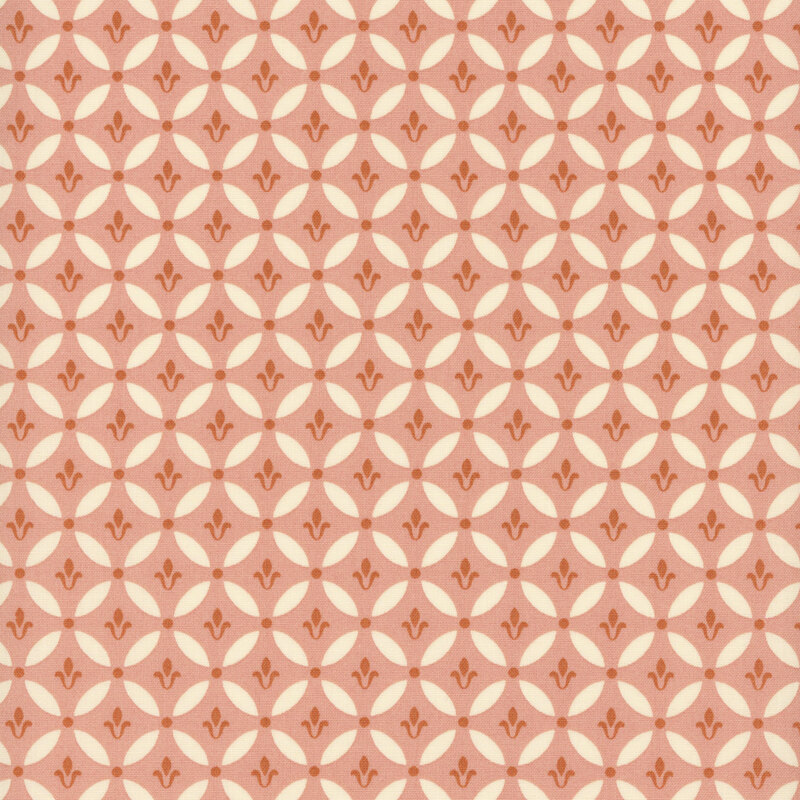 Coral pink fabric with a geometric pattern of stylized floral motifs within circles.