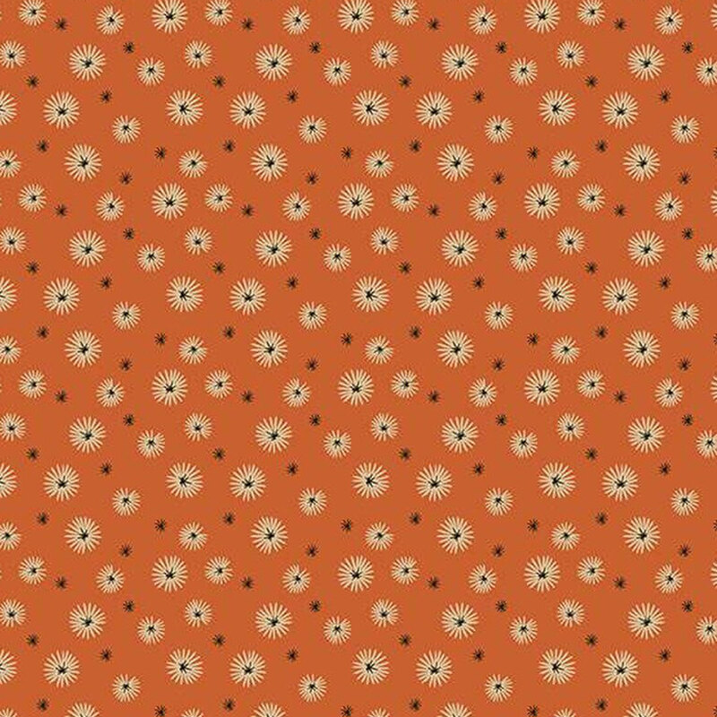 fabric pattern of white dandelions on a orange background