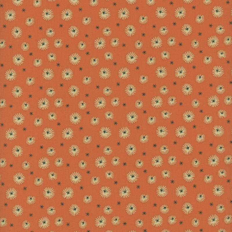 fabric pattern of white dandelions on a burnt orange background.