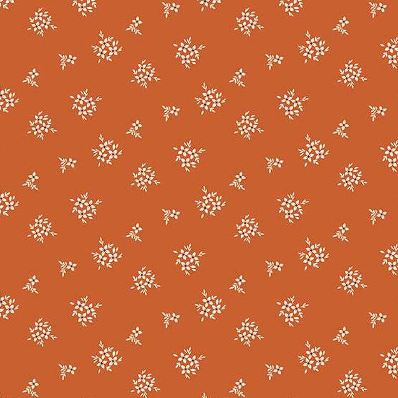 fabric pattern of floral bouquets on a burnt orange background