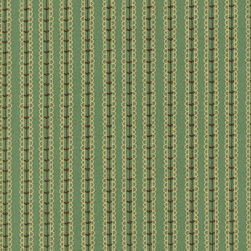 fabric of leaves on a vine in a striped pattern all on an emerald background.