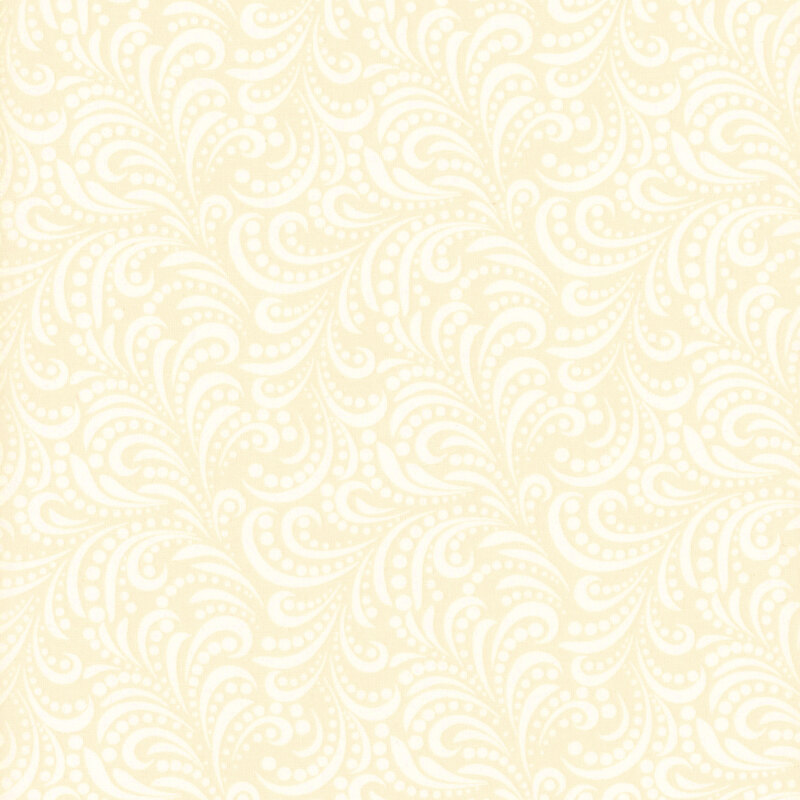 fabric pattern of white swirls on a cream background.