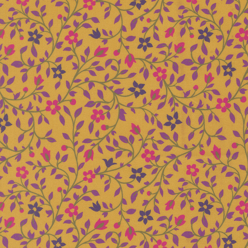 A golden yellow fabric with intricate floral patterns in pink, purple, and green.