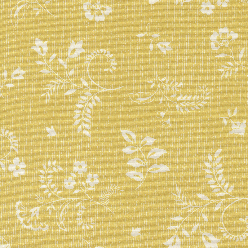 Textured yellow fabric with white floral and leaf designs.