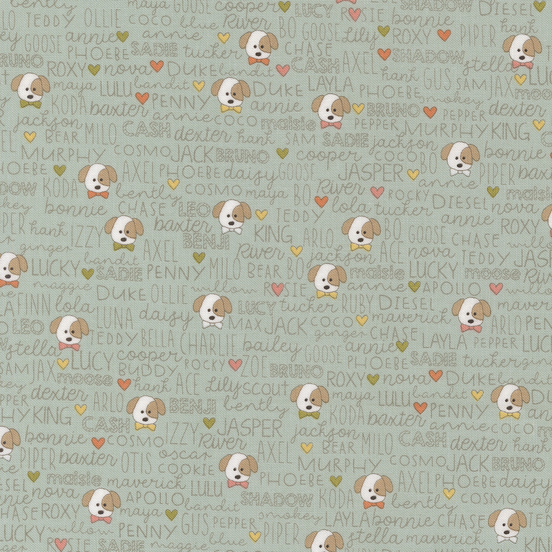 Light aqua fabric featuring various dog names and illustrations of puppies with colorful hearts