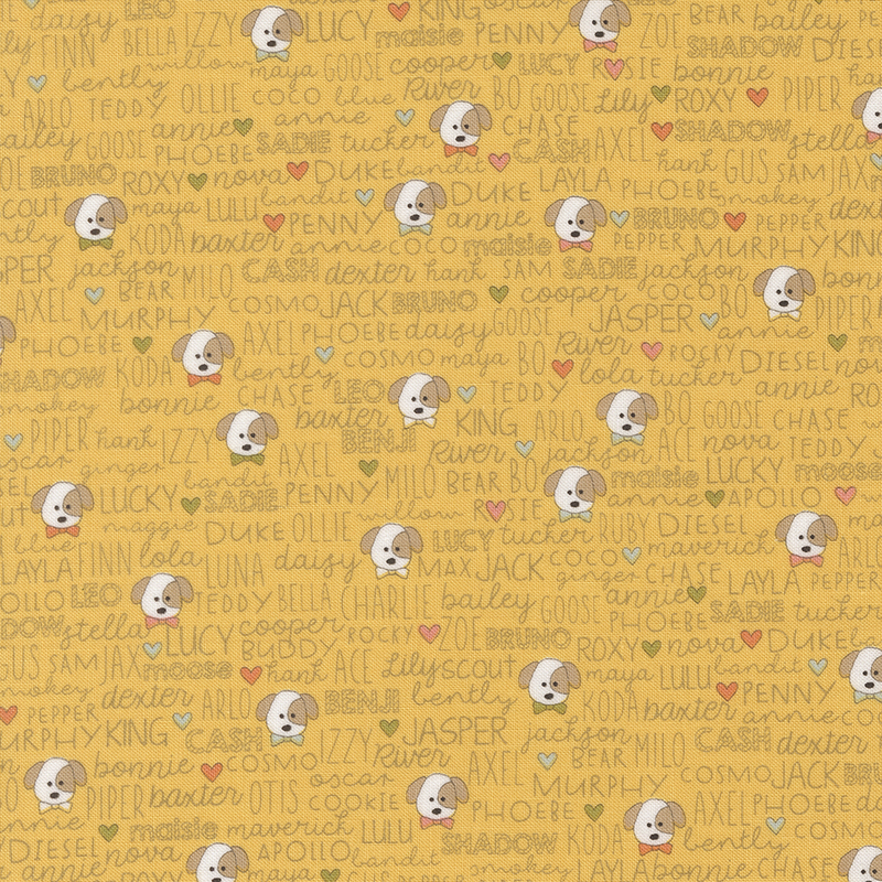 Golden yellow fabric featuring various dog names and illustrations of puppies with colorful hearts