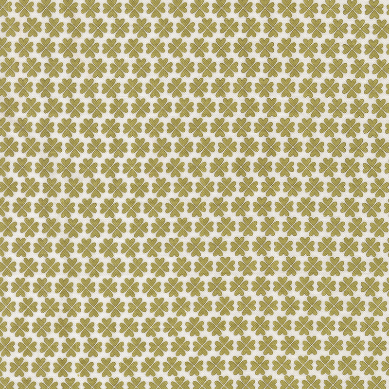 Pattern of small green floral shapes on a cream background.