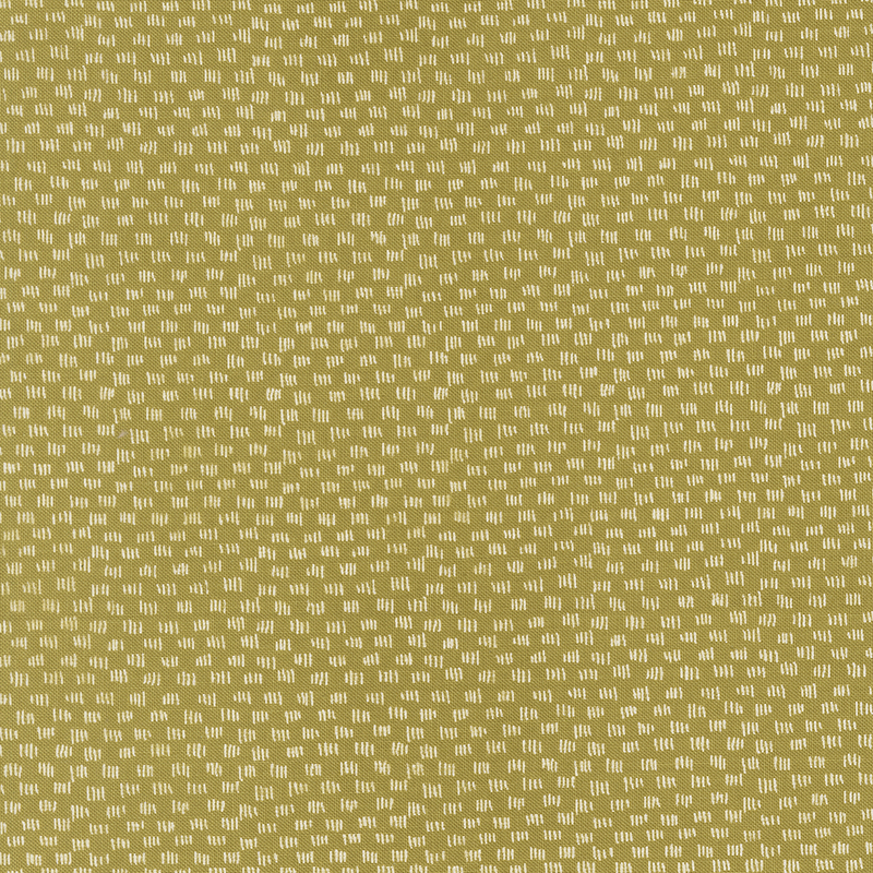 Olive green fabric featuring a repeating pattern of small white shapes