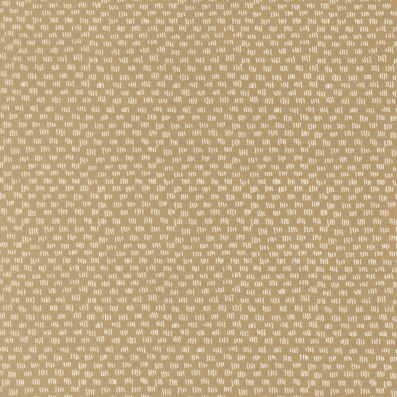 Tan fabric featuring a repeating pattern of small white shapes