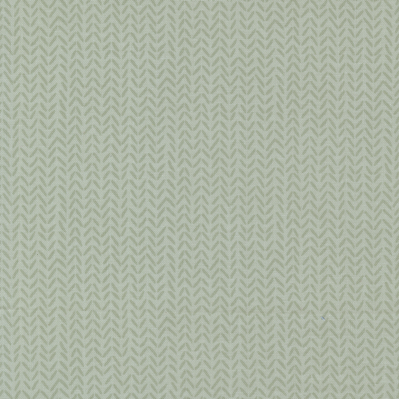 Tonal light aqua fabric with a subtle repeating herringbone pattern