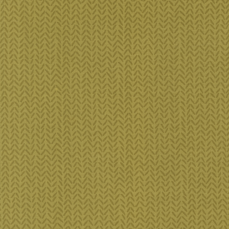 Tonal olive green fabric with a subtle repeating herringbone pattern