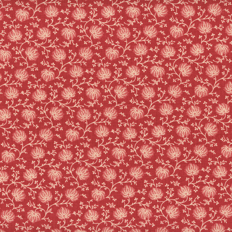 fabric pattern of tan florals on a red background