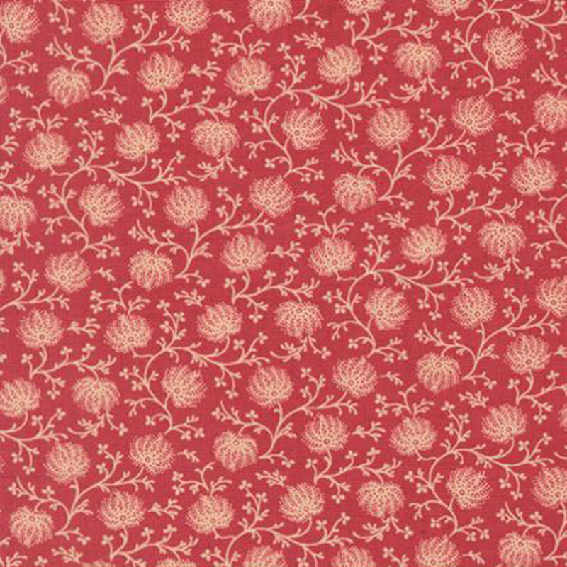 fabric pattern of tan florals on a red background