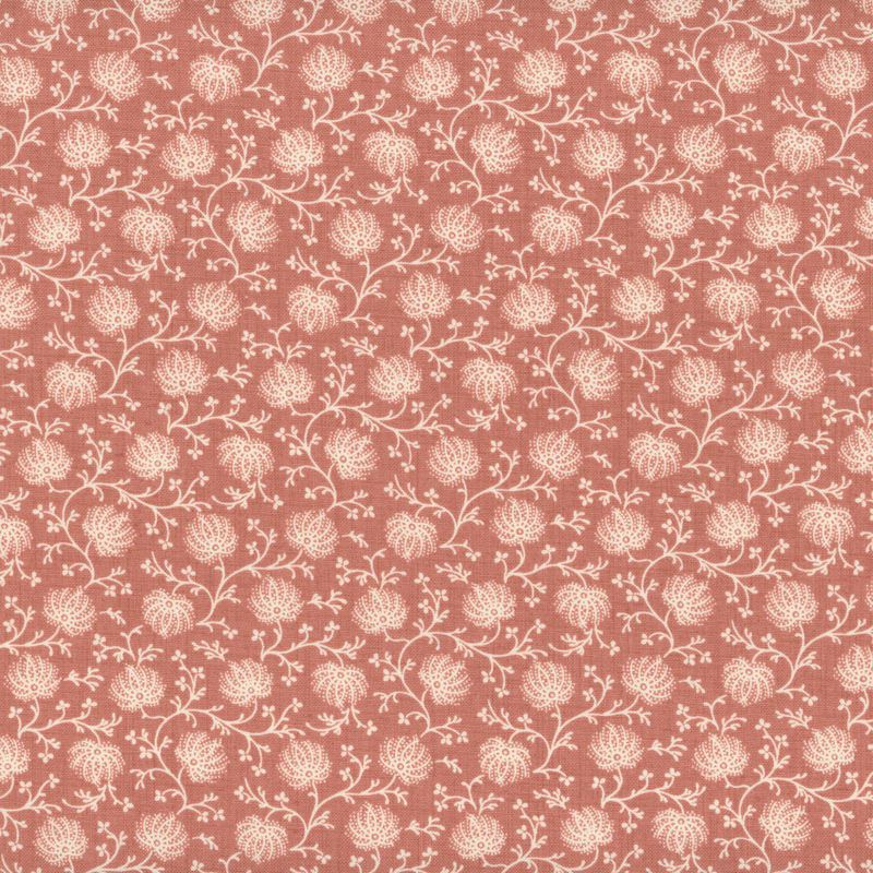 fabric pattern of florals over a soft red background