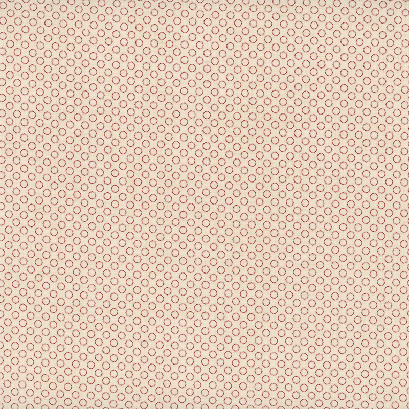 fabric pattern of circles all over a cream background