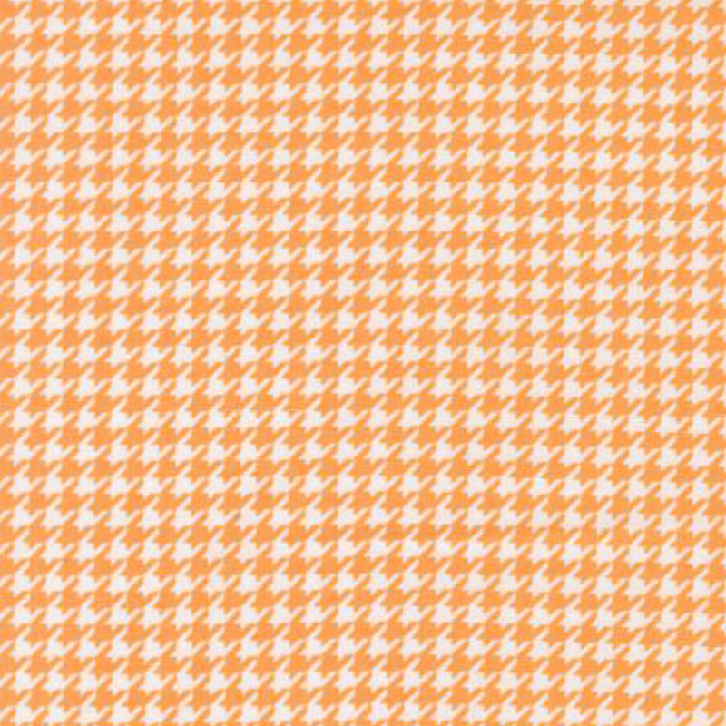 fabric pattern of an orange and white houndstooth pattern