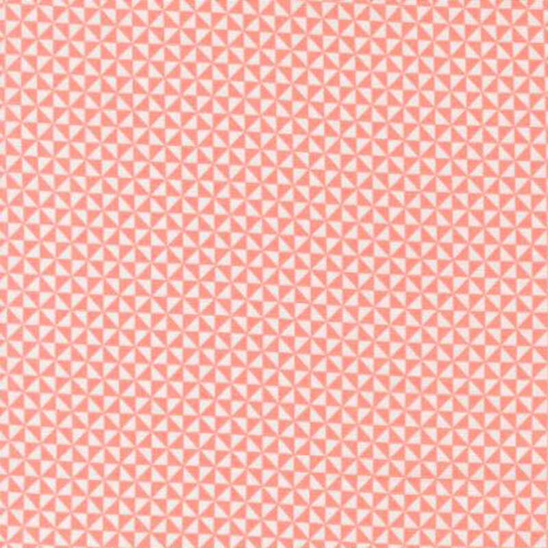 fabric pattern of small triangles in shades of pink and white