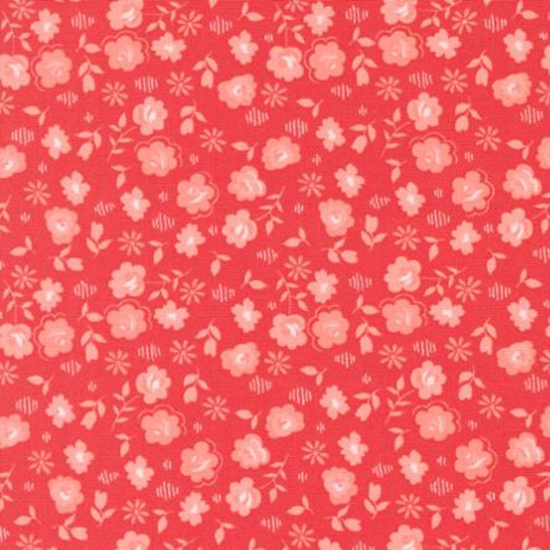 fabric pattern of flowers scattered all over a red background