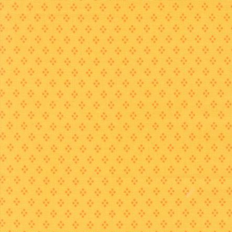 fabric pattern of deep yellow motifs all over a light yellow background