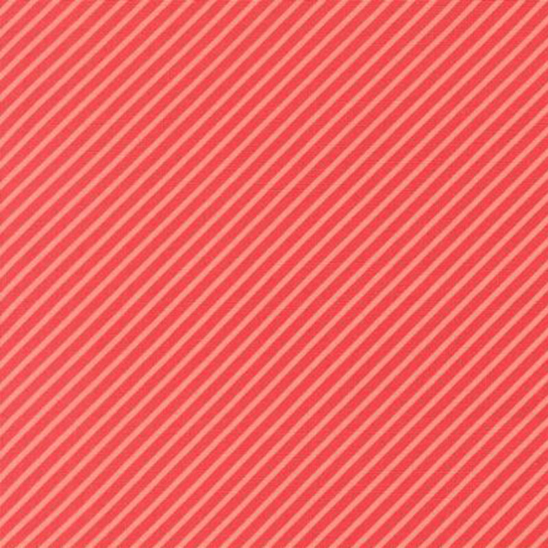 fabric pattern of soft red strips in a diagonal direction on a  red background