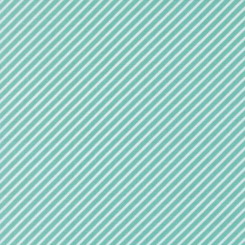 fabric pattern of white strips in a diagonal direction on a teal background