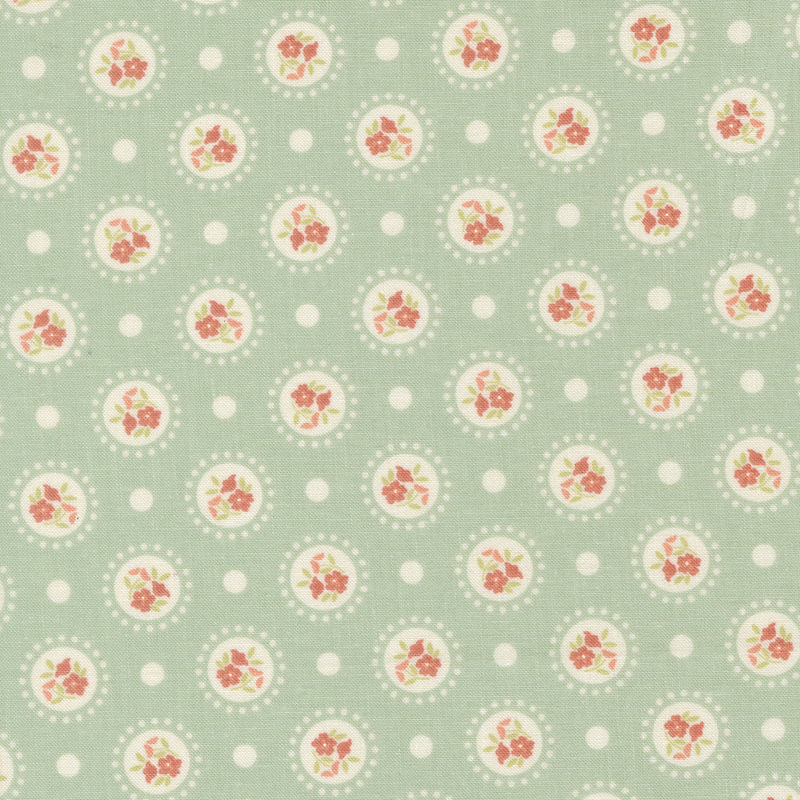 Dark aqua fabric with medallions of red flowers on a polka dotted background.