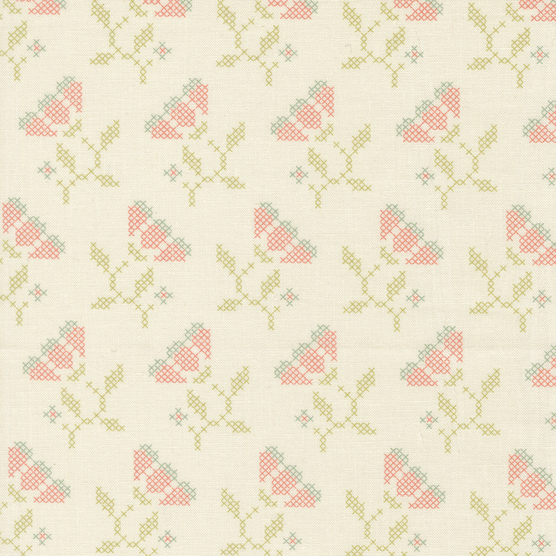 Cream fabric with cross-stitched flowers.