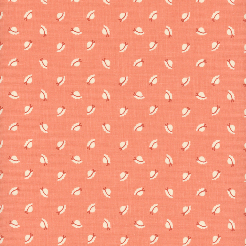 Coral pink fabric with ditsy sunbonnets.