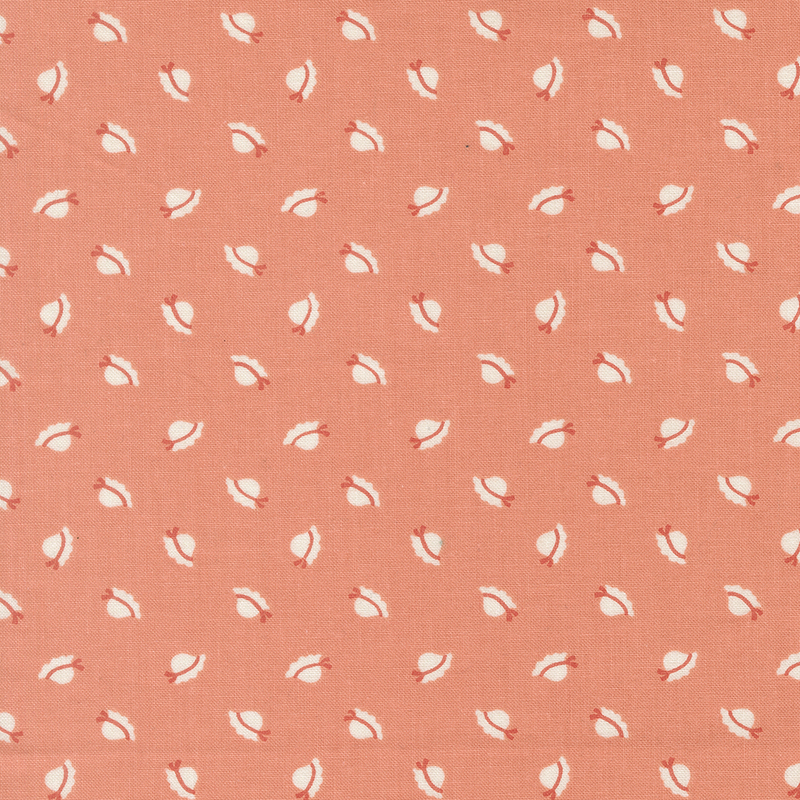 Coral pink fabric with ditsy sunbonnets.