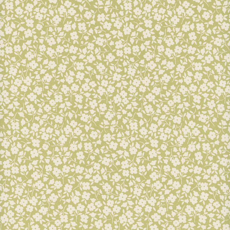 Green fabric with a packed design of white flowers.