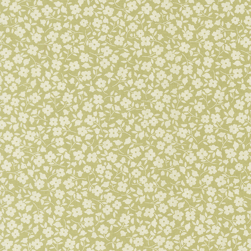 Green fabric with a packed design of white flowers.