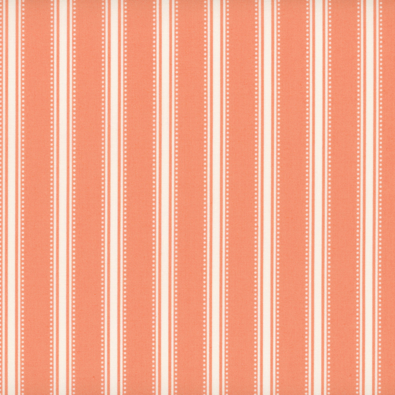 Coral pink fabric with dotted cream stripes.