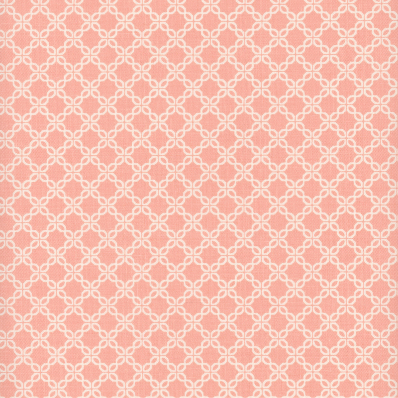 Pink fabric with a chain-like geometric pattern.