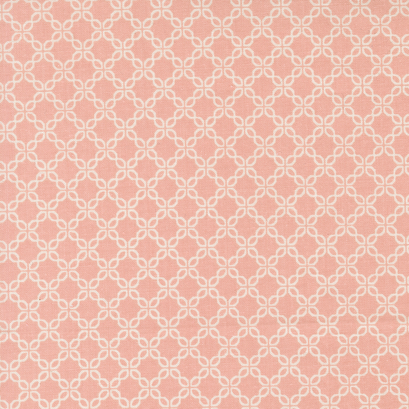 Pink fabric with a chain-like geometric pattern.