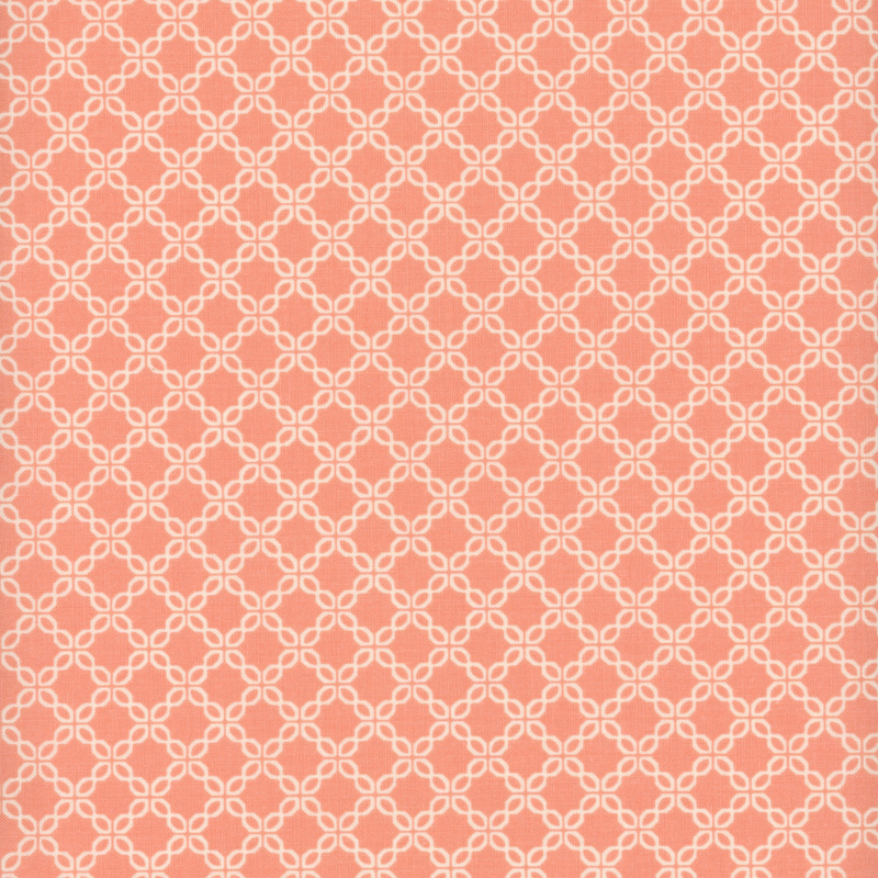 Coral pink fabric with a chain-like geometric pattern.