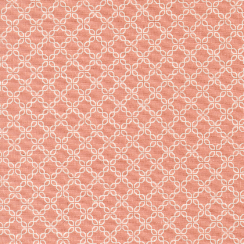 Coral pink fabric with a chain-like geometric pattern.