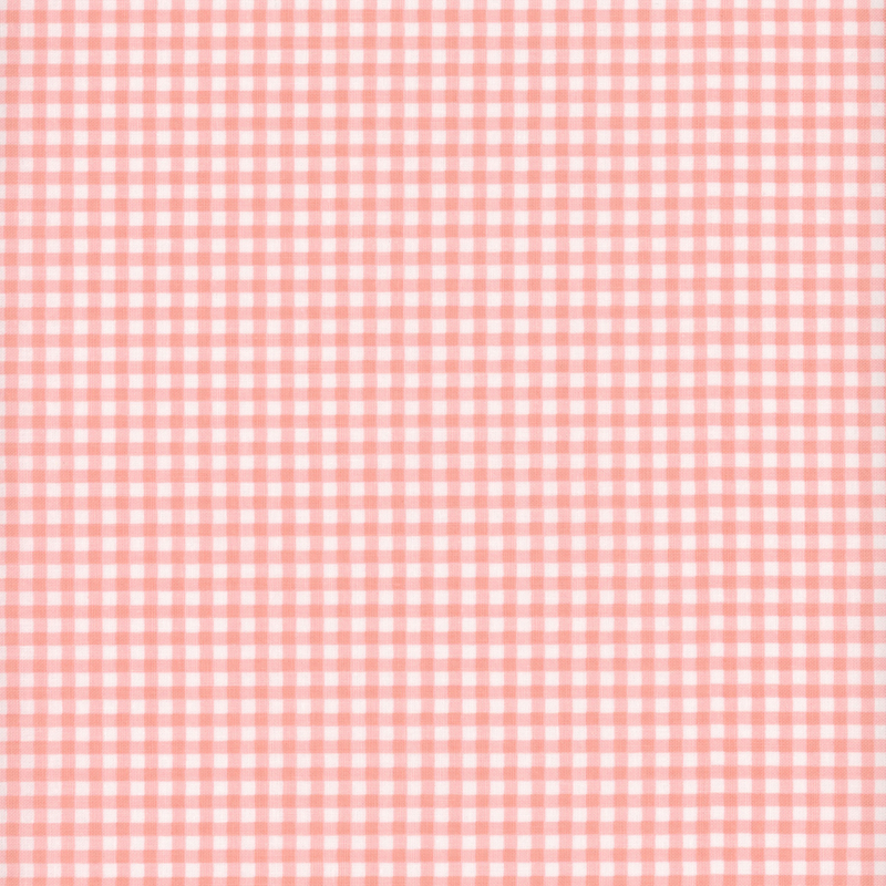 Pink fabric with tiny gingham print.