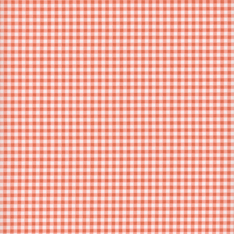 Coral pink fabric with tiny gingham print.