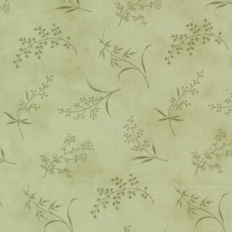 fabric pattern of ditsy leaves and flowers on a green background