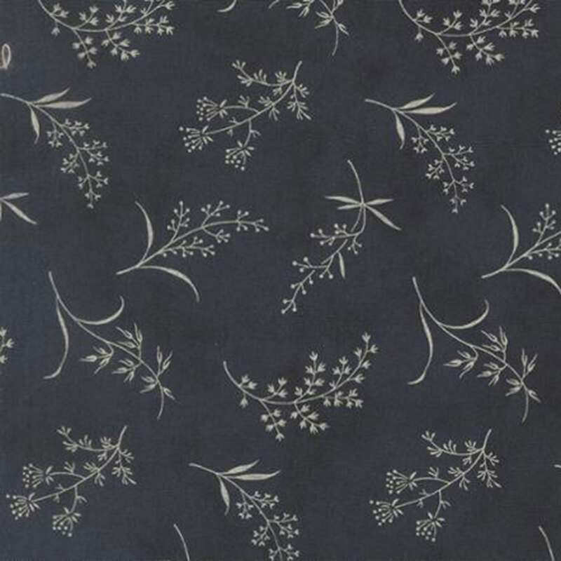 fabric pattern of ditsy leaves and flowers on a dark blue background