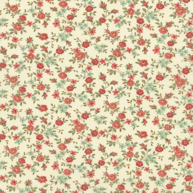 Fabric pattern of scattered roses all over a cream background.