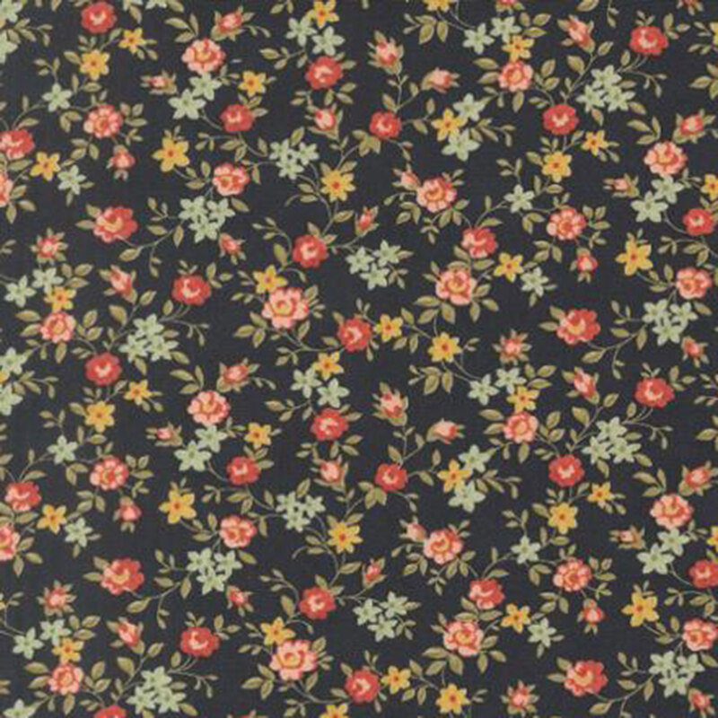 fabric pattern of roses scattered all over a dark blue background