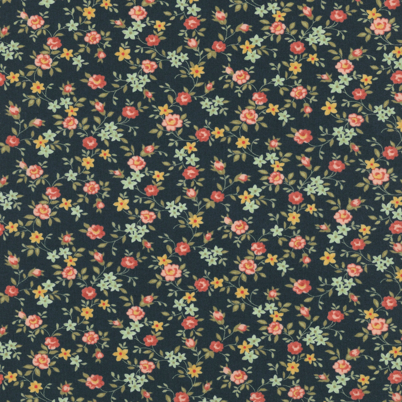 Fabric pattern of scattered roses all over a dark blue background.